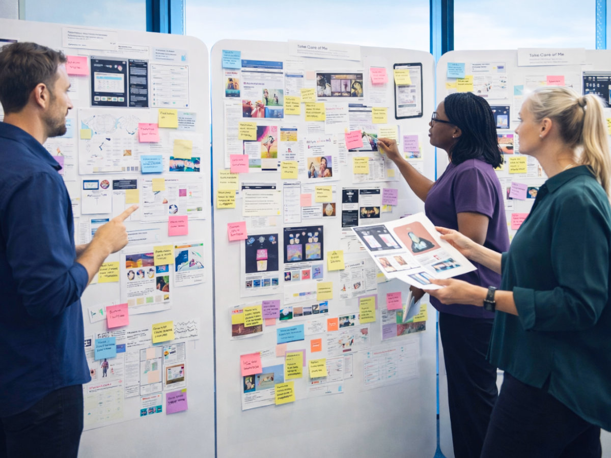 Team reviewing product strategy on a board